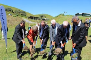 NZ Prime Minister John Key (third from left) and other dignitaries turn the sod at the spot where the Hawaiki cable will make landfall on a beach in Northland, New Zealand